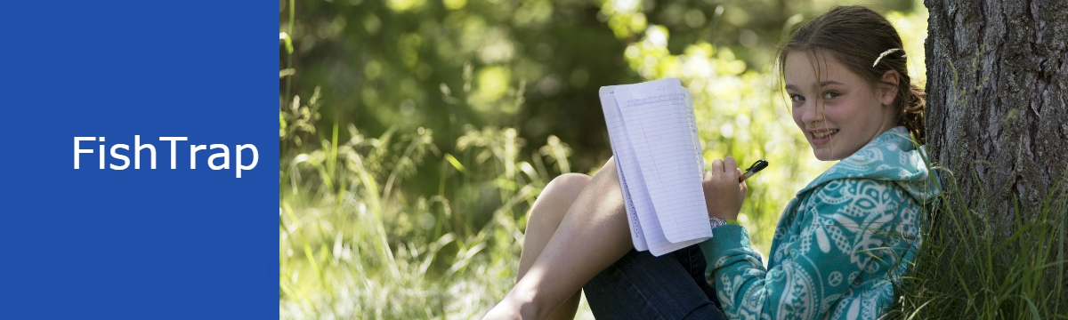 A young girl with Fish Trap leans against a tree writing in a journal 